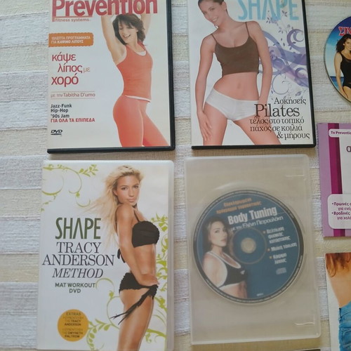 9 DVDs with fitness, pilates, wellness and yoga programs like new