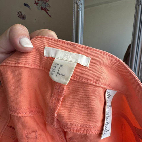 H&M orange fabric shorts, size 38