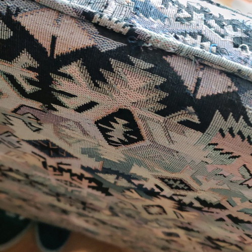 Armchair used made of good wood with fabric cover