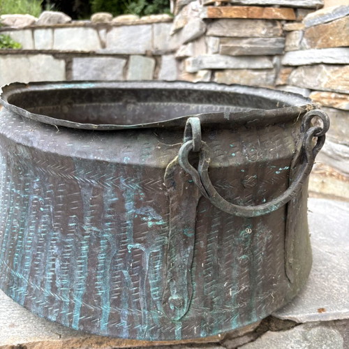 Vintage copper cauldron with hand-forged decoration used
