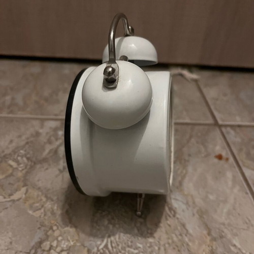 Table clock used, white with crack