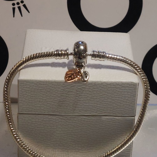 Pandora bracelet size 18 with round clasp and two leaf charms