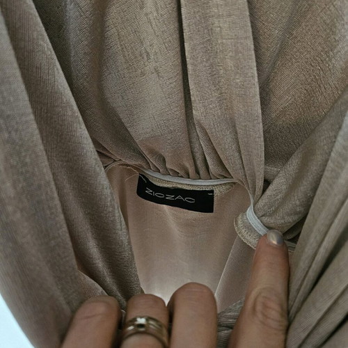 Beige-gold bodysuit like new with draped neckline and laser cut detail