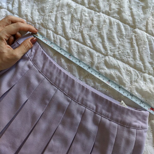 Mini skirt with pleats like new, pastel purple, size 34