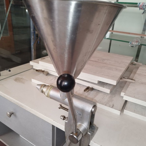Manual dough depositor with stainless steel hopper and lever