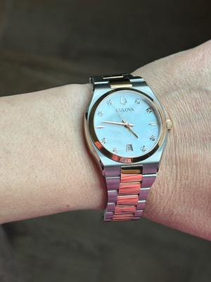 Bulova women's bicolor watch with mother-of-pearl dial and diamonds
