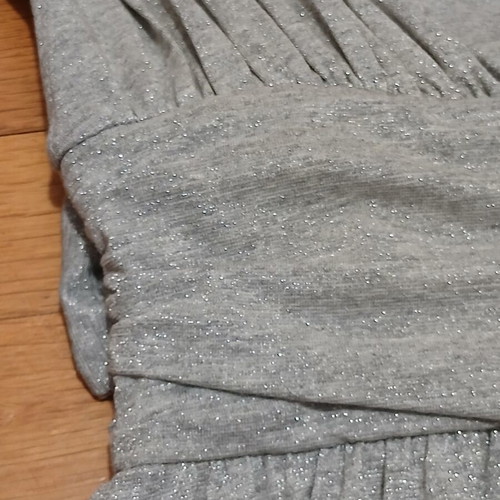 Dress gray silver with V neckline and bow tie at waist size Medium like new