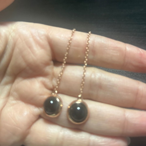 Dangling earrings, black and gold