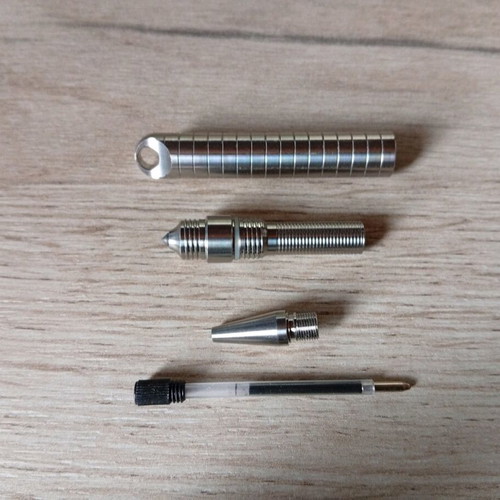 Mini titanium pen like new with Frag Pattern and carbide tip
