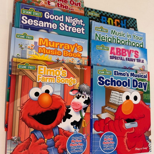 Sesame Street 8-Book Library with Portable Piano like new