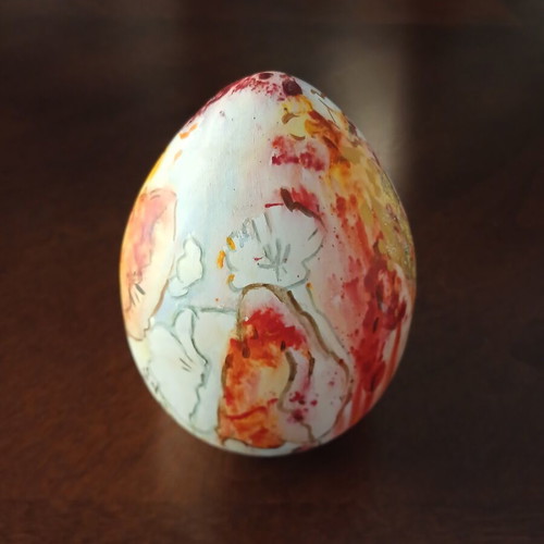 Hand-painted ceramic egg with floral and female figure design