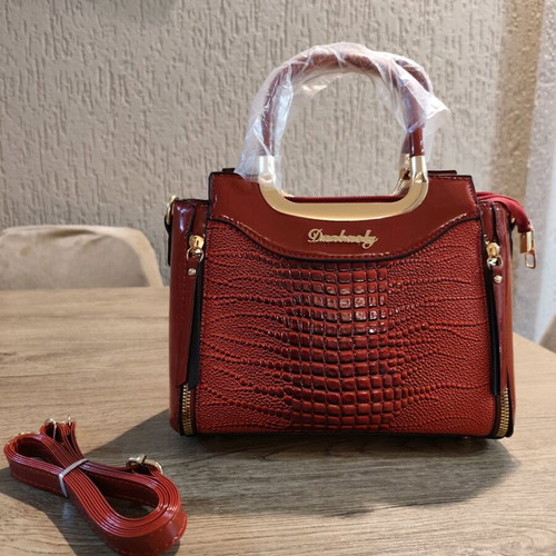 Red handbag new with strap and pockets