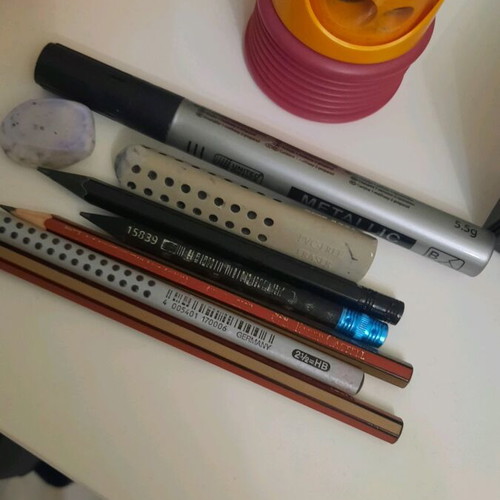 Pencils pens erasers and sharpener set used