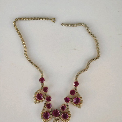 Antique necklace used with pink stones and gold rhinestones