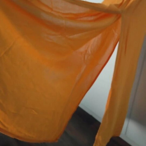 Semi-sheer long orange dress with side slits