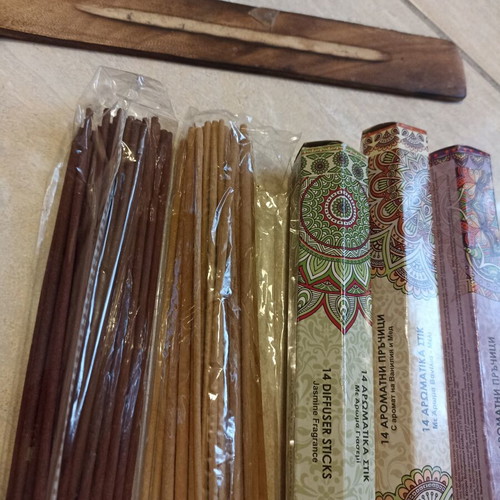 Aromatic incense sticks with wooden base, assorted scents