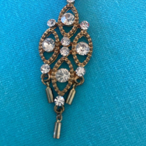 Gold pendant like new with sparkling rhinestones