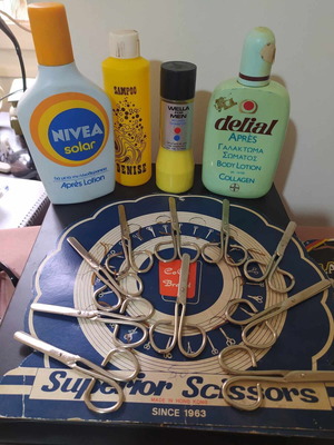Old sealed shampoo bottles and vintage scissors