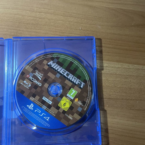 PlayStation 4 console with 2 controllers, NBA 2K25, FIFA 20, Minecraft