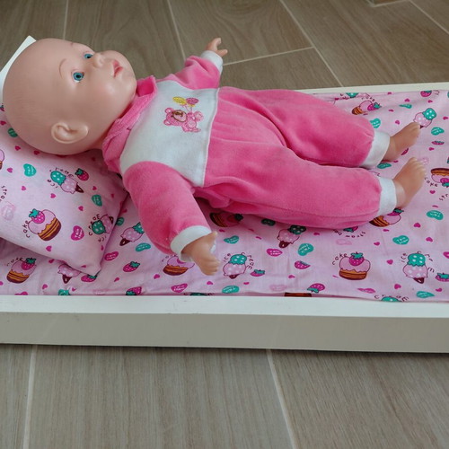 Doll bed with handmade bedding and doll used