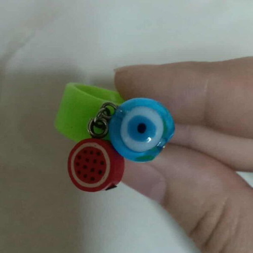 Ring with eye and watermelon charm like new, green multicolor