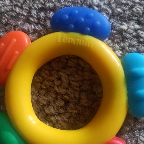 Teether and rattle with handle