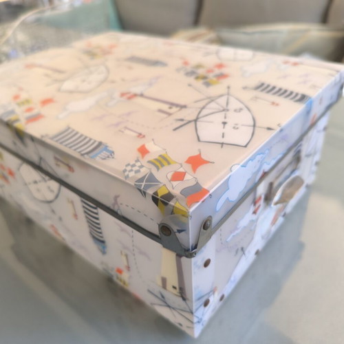 Decorative storage box used with nautical theme, lighthouses and flags
