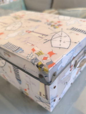 Decorative storage box used with nautical theme, lighthouses and flags