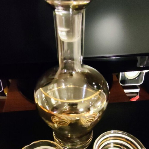 Vintage glass decanter set with 2 glasses used, gold decorations