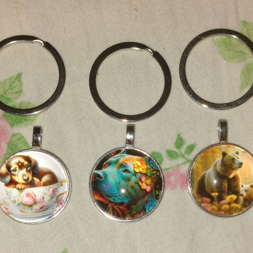 Pack of new fashion keychains with metal and glass medallions