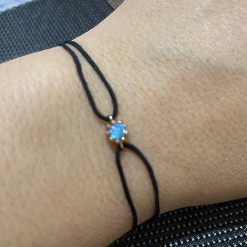 Bracelet with cord and silver pendant like new