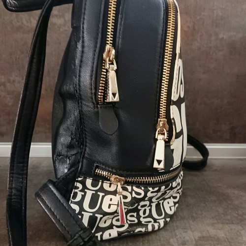 Guess backpack used with leather cracks