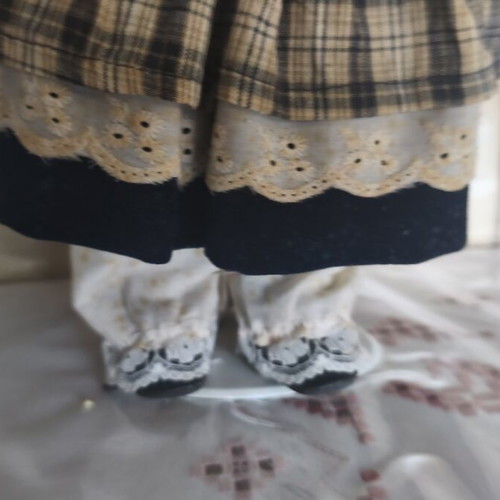Porcelain doll vintage collective used with dress stains