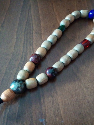 Wooden komboloi with glass and metal beads used