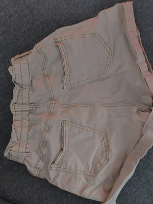 Beige shorts used, size M