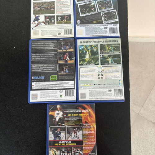 Bundle of used sports games for PlayStation 2 with manuals