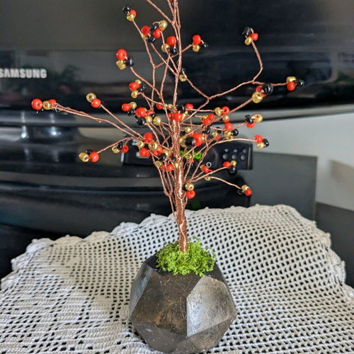 Decorative handmade tree with plaster base and painted details
