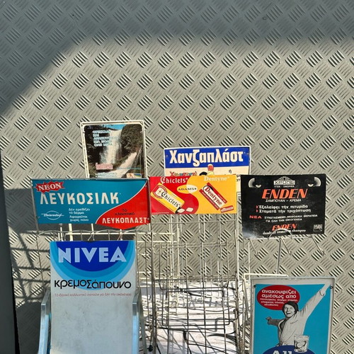 Retro kiosk stand used with authentic vintage advertisements