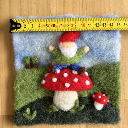 Handmade wool wall art with gnome on mushroom