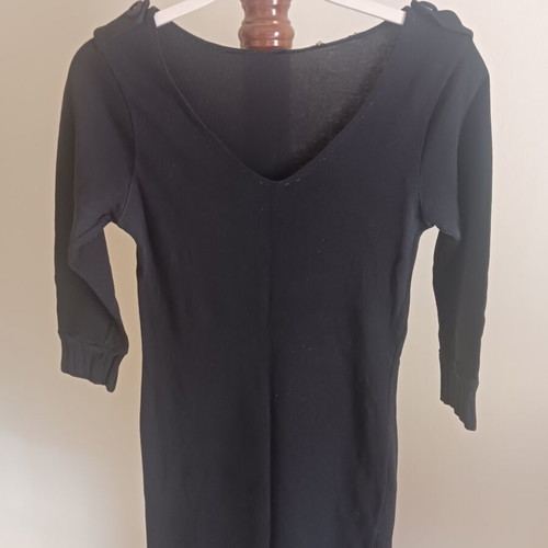 Black dress with shoulder buttons and distinctive sleeves