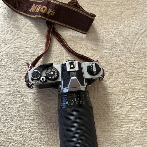 Nikon FM2 35 mm camera used with Telezon telephoto lens and lens cap