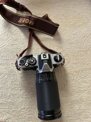 Nikon FM2 35 mm camera used with Telezon telephoto lens and lens cap