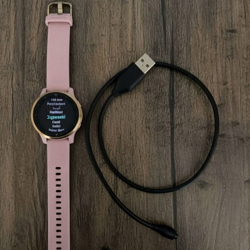 Garmin Vivoactive 4S smartwatch with gold and pink strap, like new