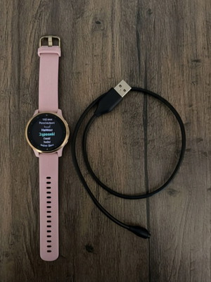Garmin Vivoactive 4S smartwatch with gold and pink strap, like new