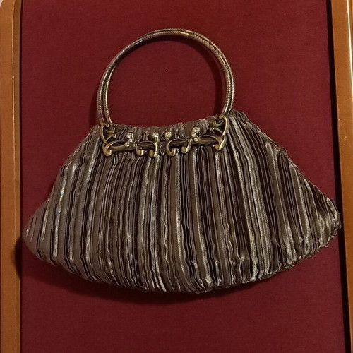 Handbag olive satin with metal details like new