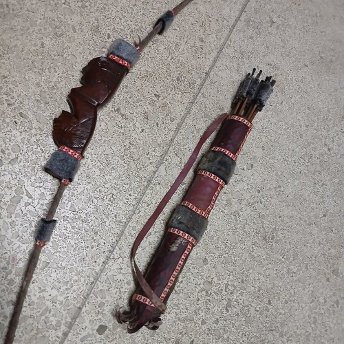Decorative wooden carved bow with arrows like new