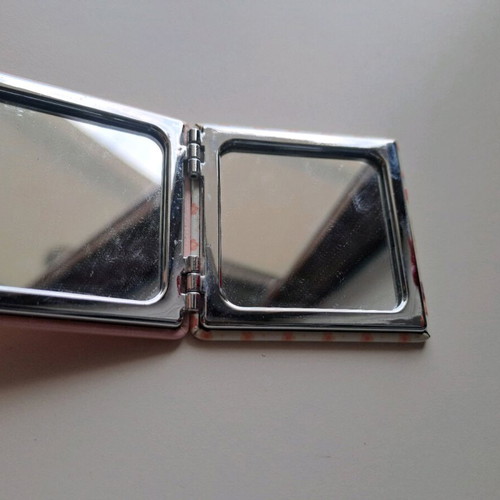 Pocket mirror with girl design used, pink