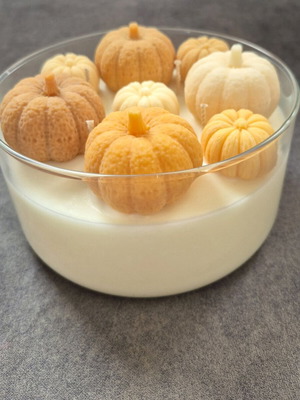 Giant soy candle handmade with pumpkin spice scent and decorative pumpkins