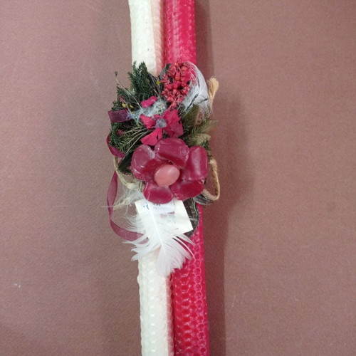Easter candle new with wax decorations and dried flowers