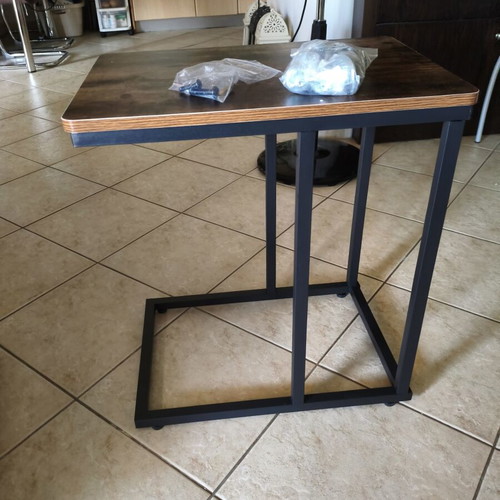 Wooden side table with metal base and wheels